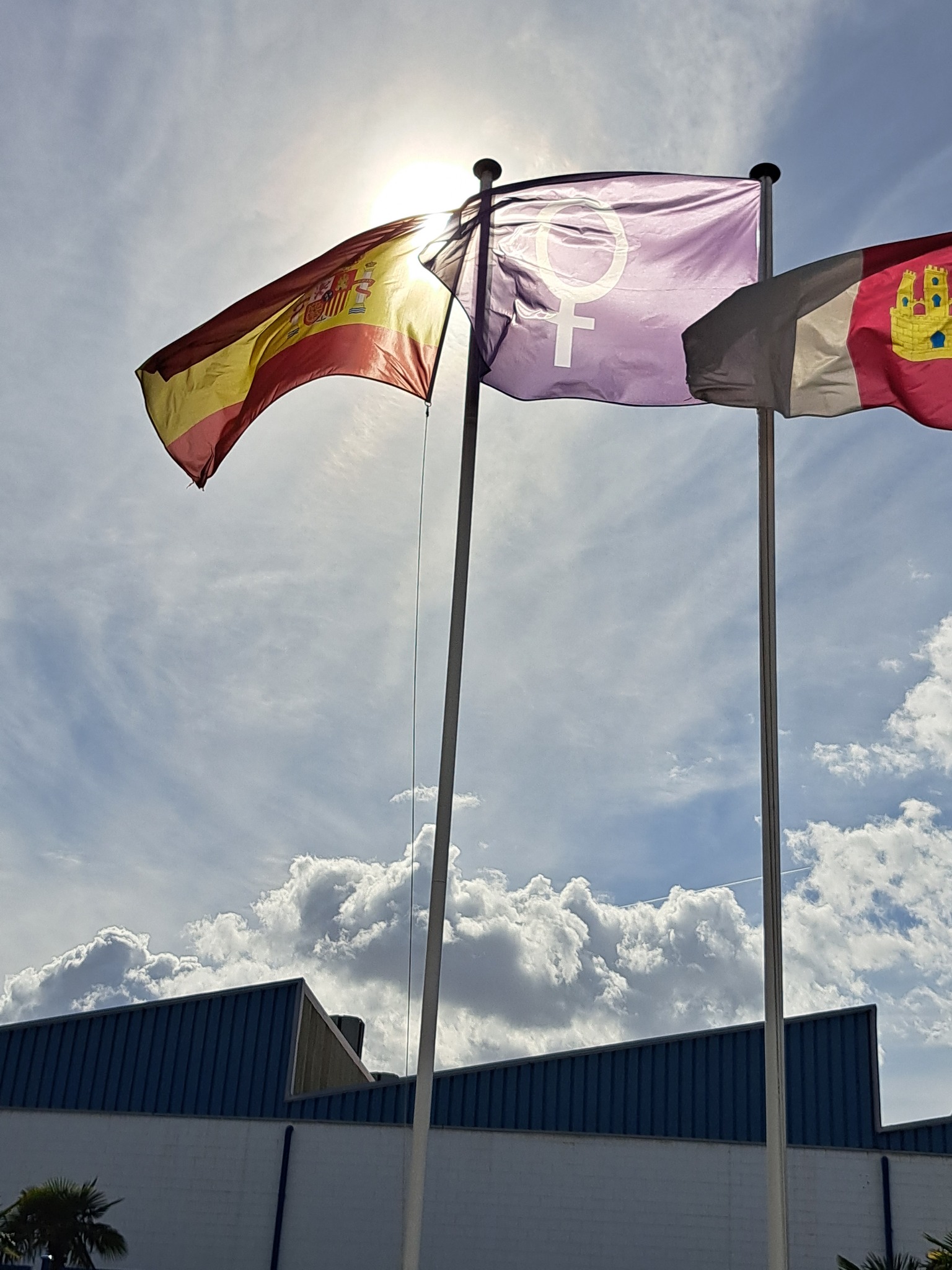 a couple of flags on poles