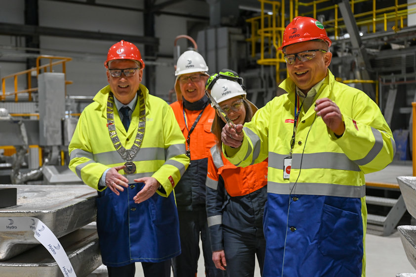 a group of people wearing safety vests
