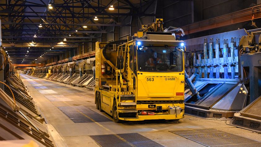 a yellow vehicle in a factory