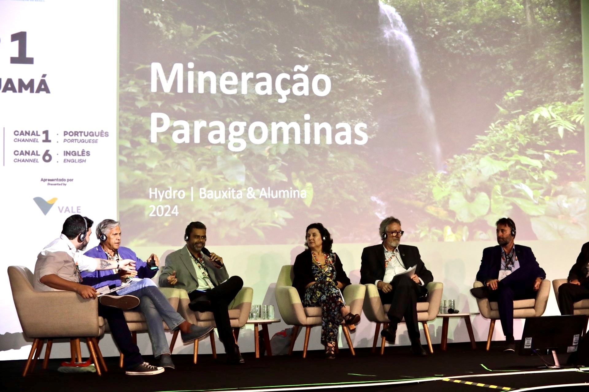 a group of people sitting on a stage