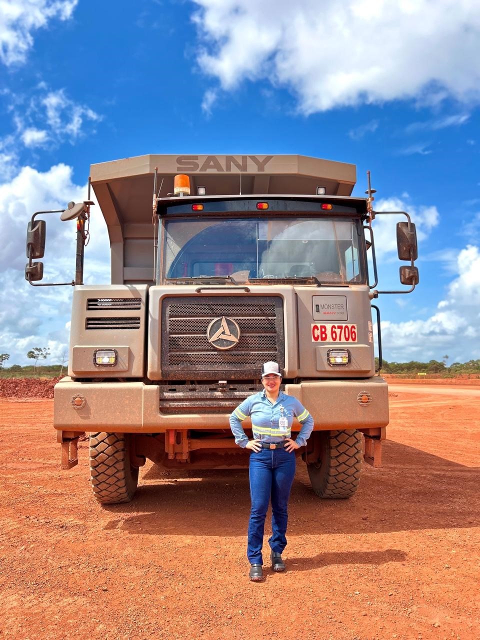 a person standing next to a large truck