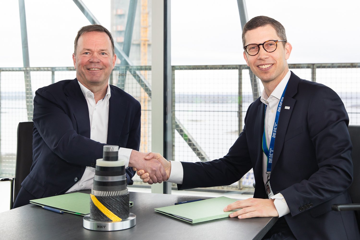 a couple of men shaking hands