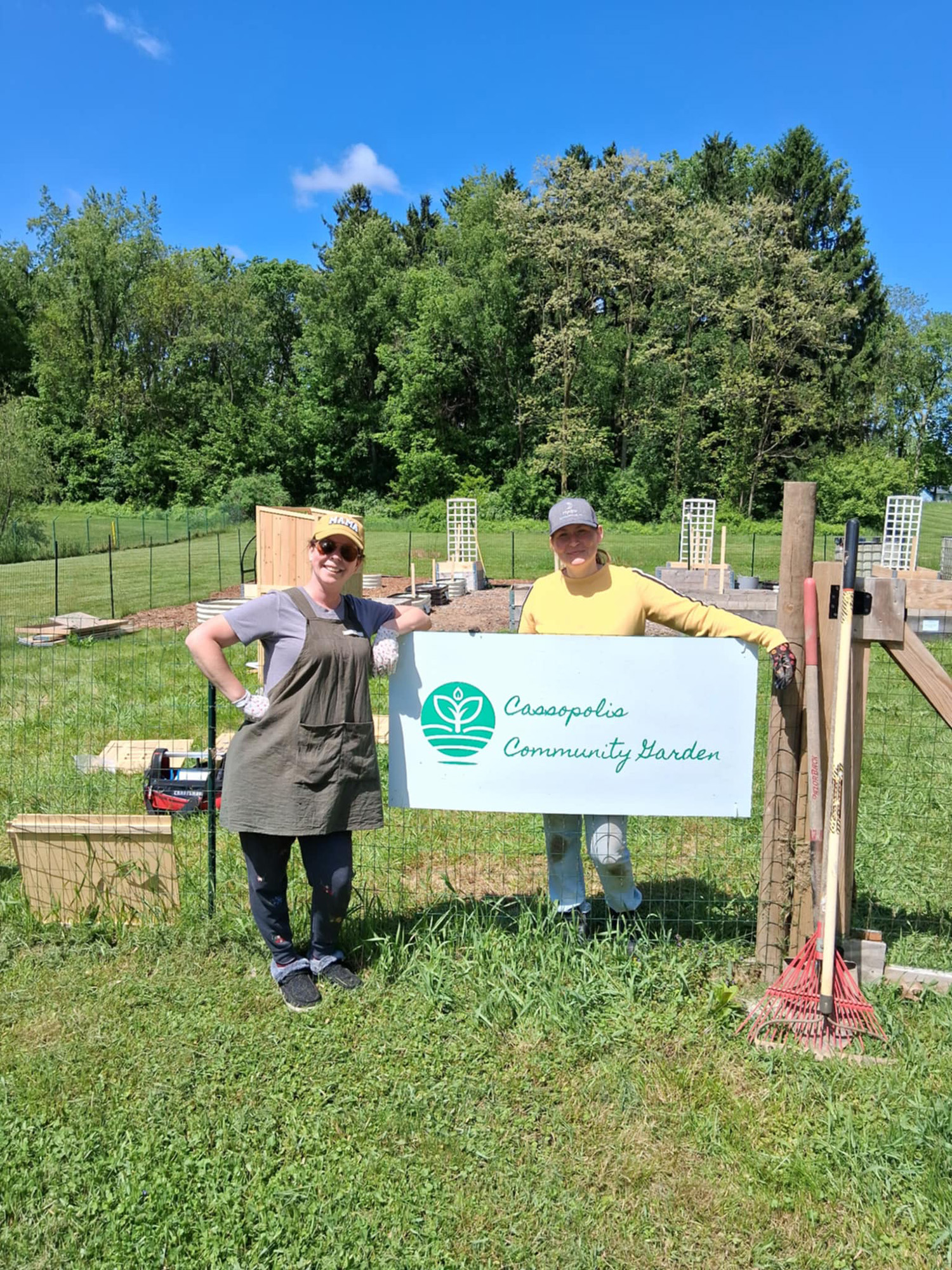 a couple of people standing near a sign