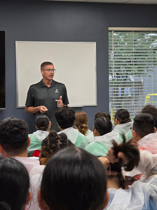 a person giving a presentation to a group of people