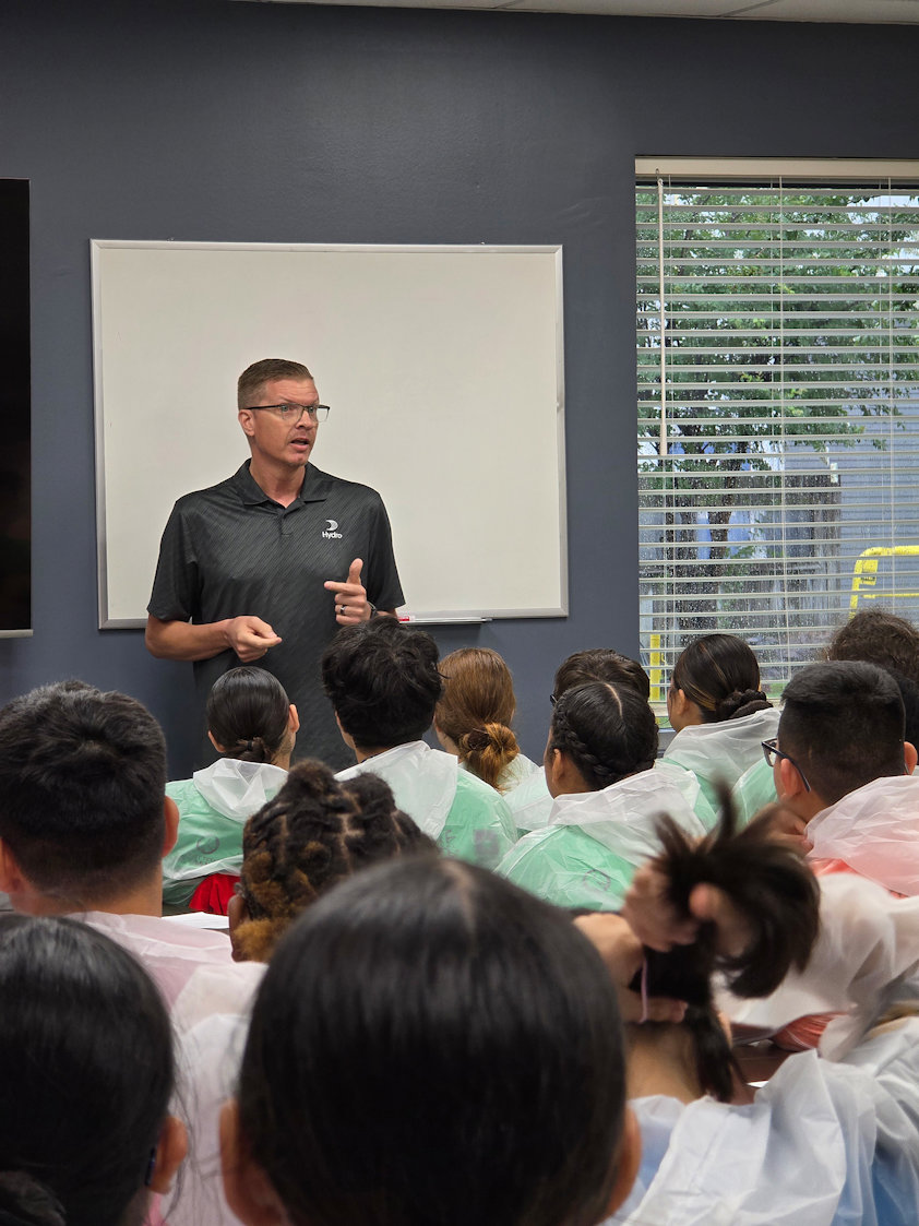 a person giving a presentation to a group of people
