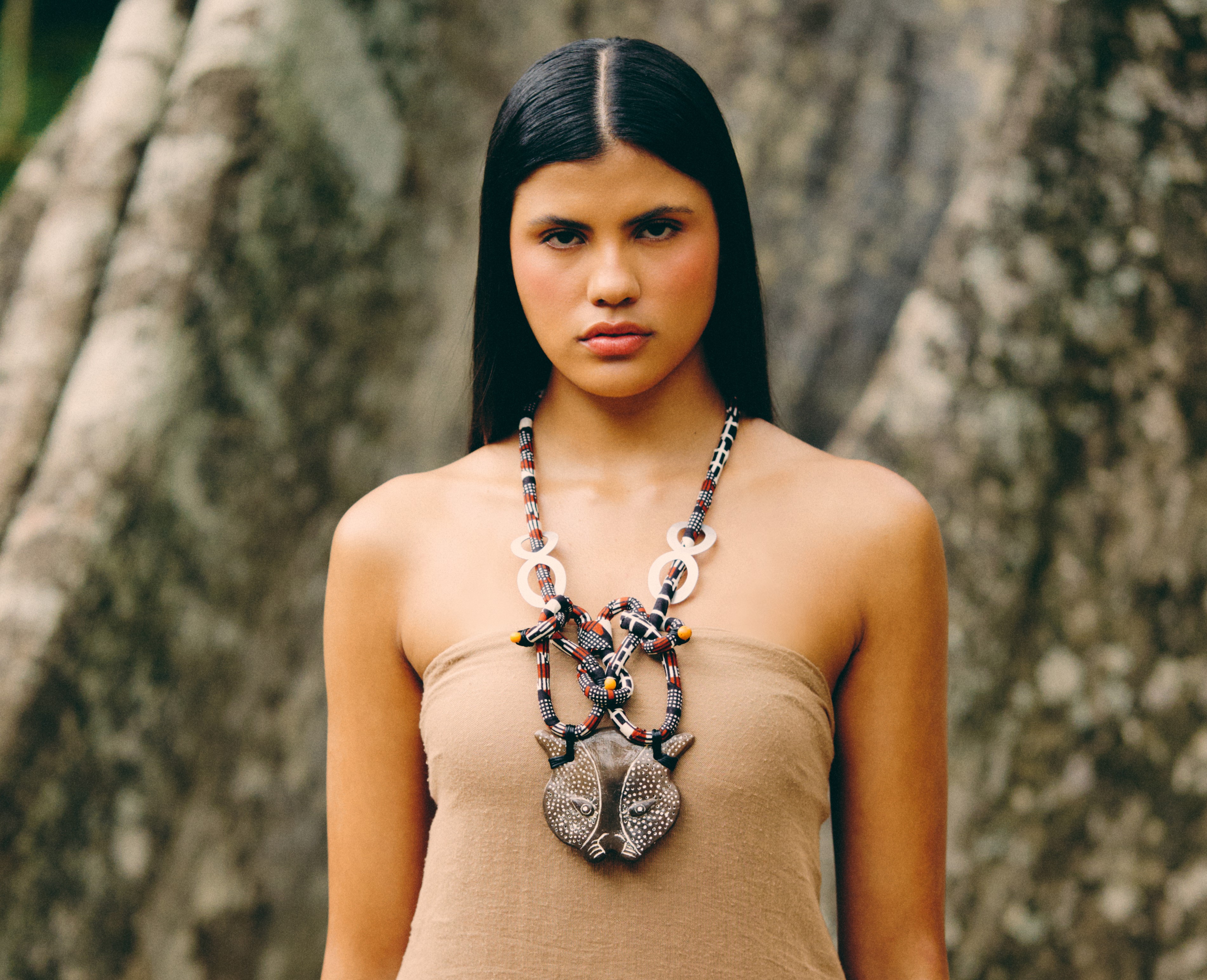 a woman wearing a necklace