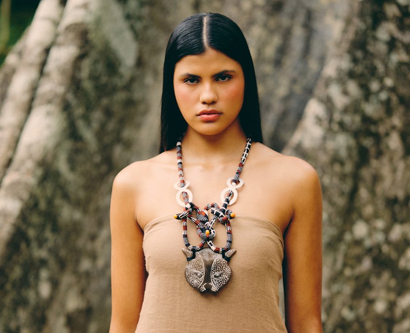 a woman wearing a necklace