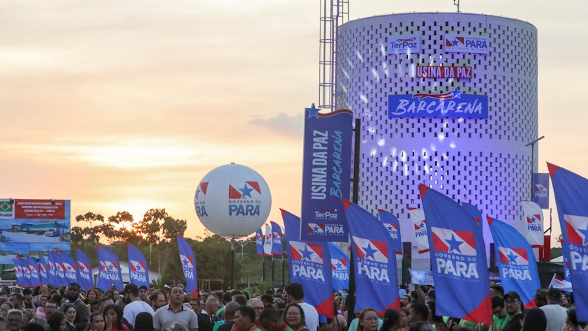 a crowd of people holding flags