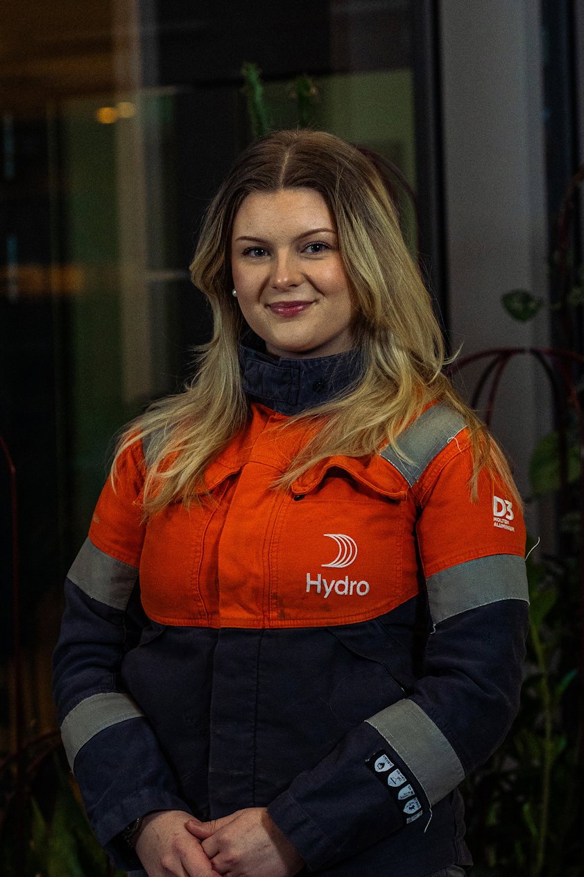 a woman in an orange and black jacket