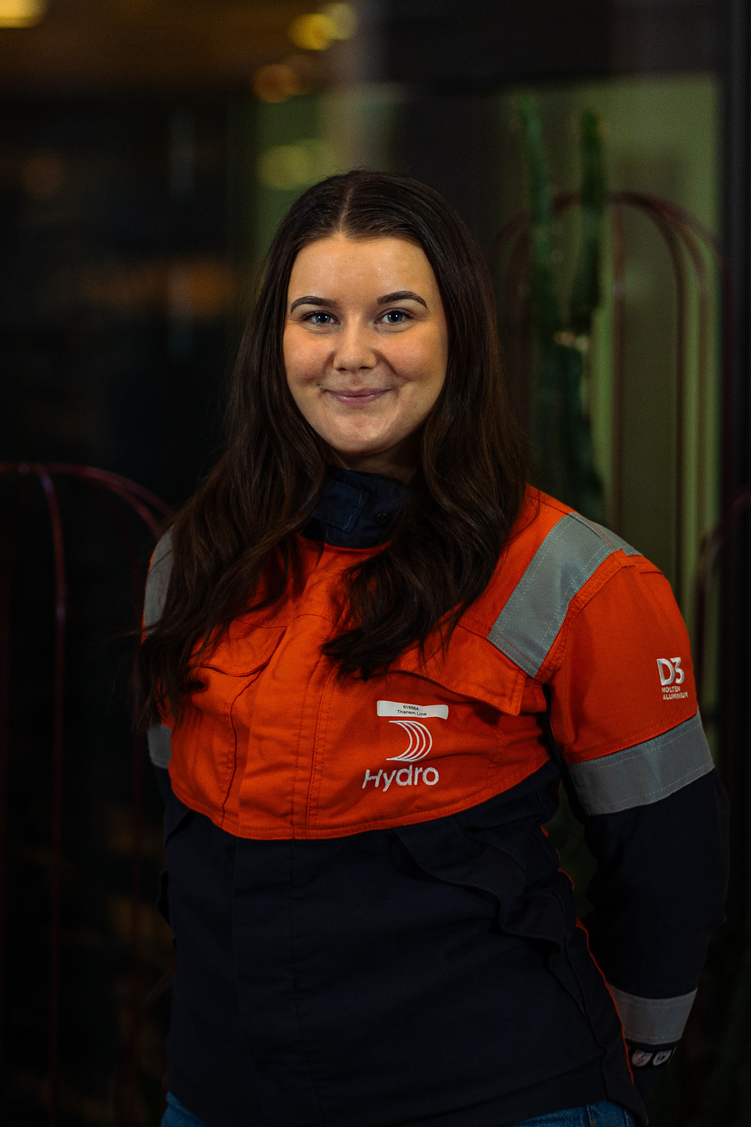a woman in an orange and black jacket