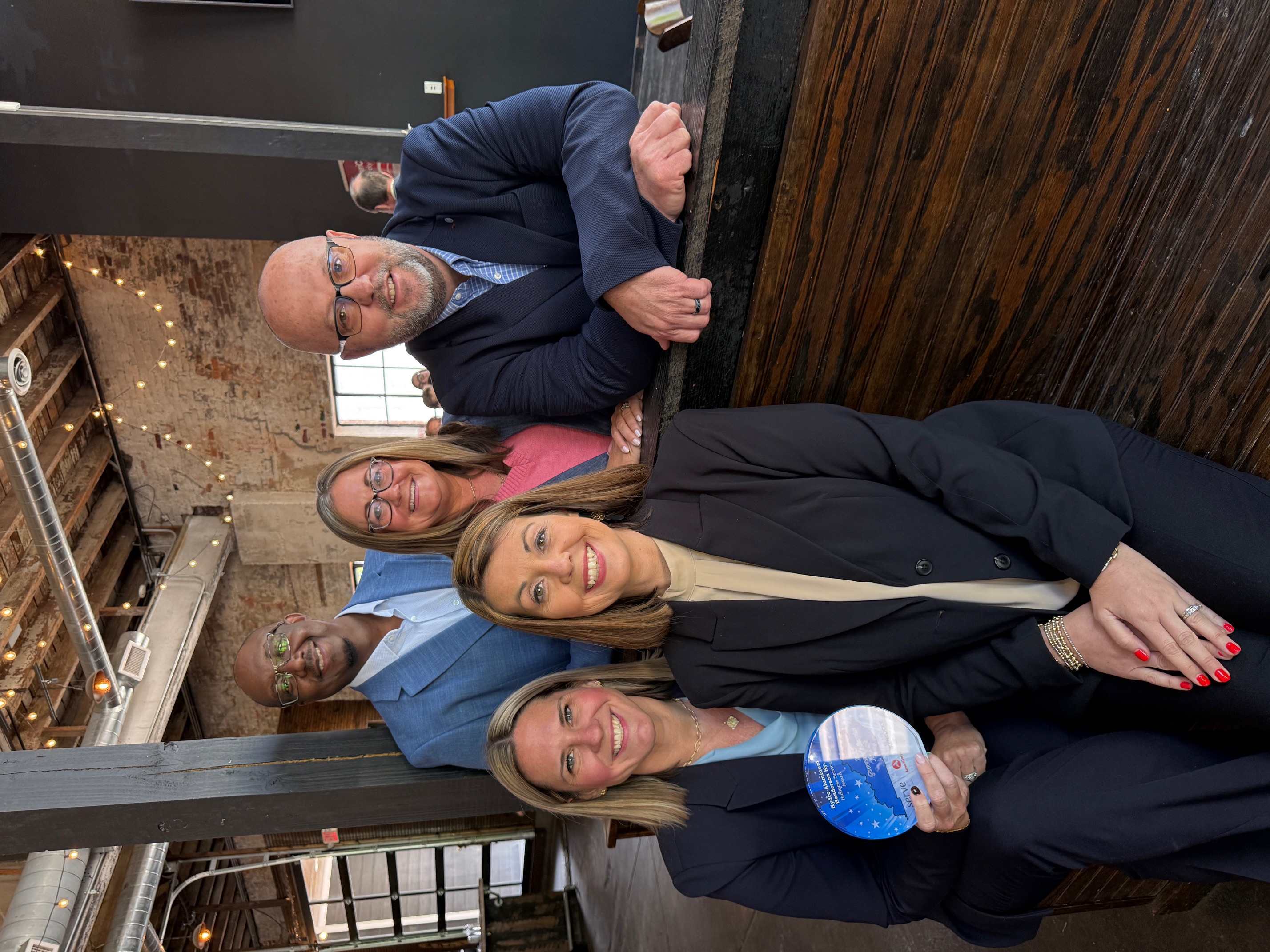 a group of people posing for a photo