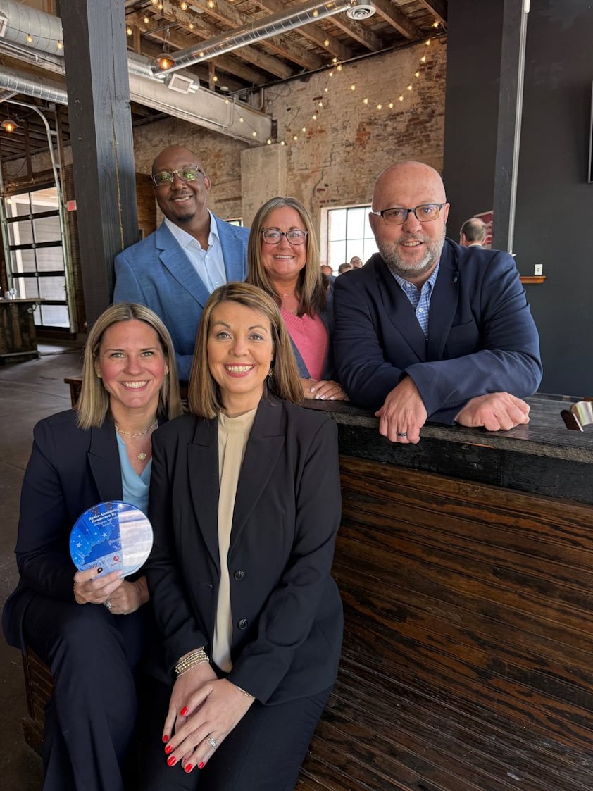 a group of people posing for a photo