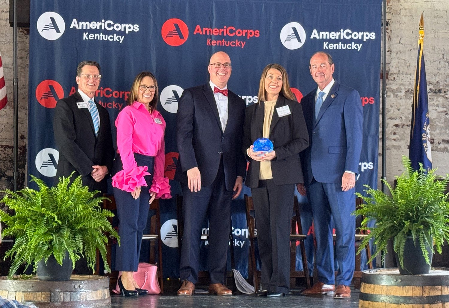 a group of people standing on a stage