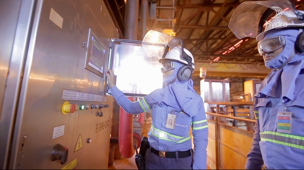 Employees operating equipment at one of Hydro's plants