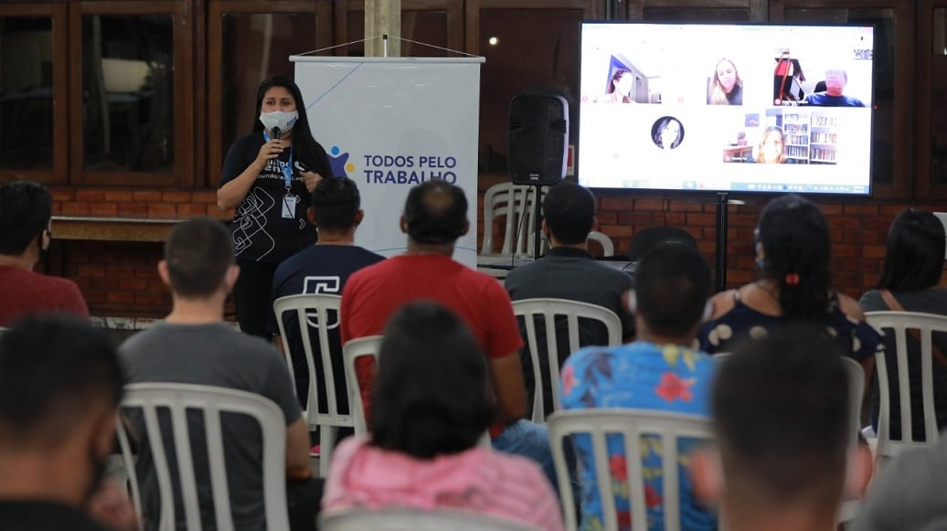 a person giving a presentation to a group of people