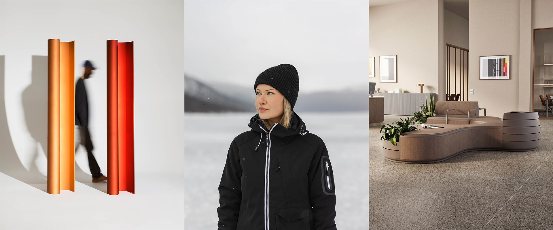 a person wearing a beanie and a black jacket in a room with a couch and a table