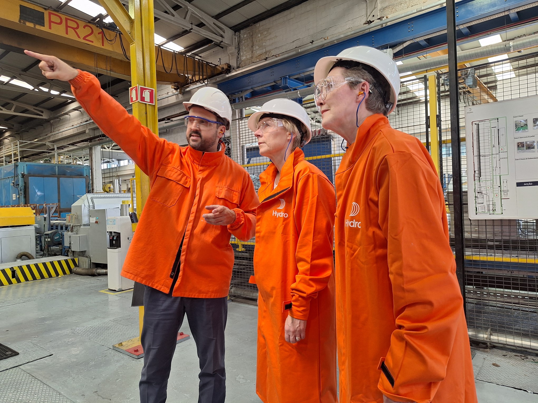 a group of men in orange jackets
