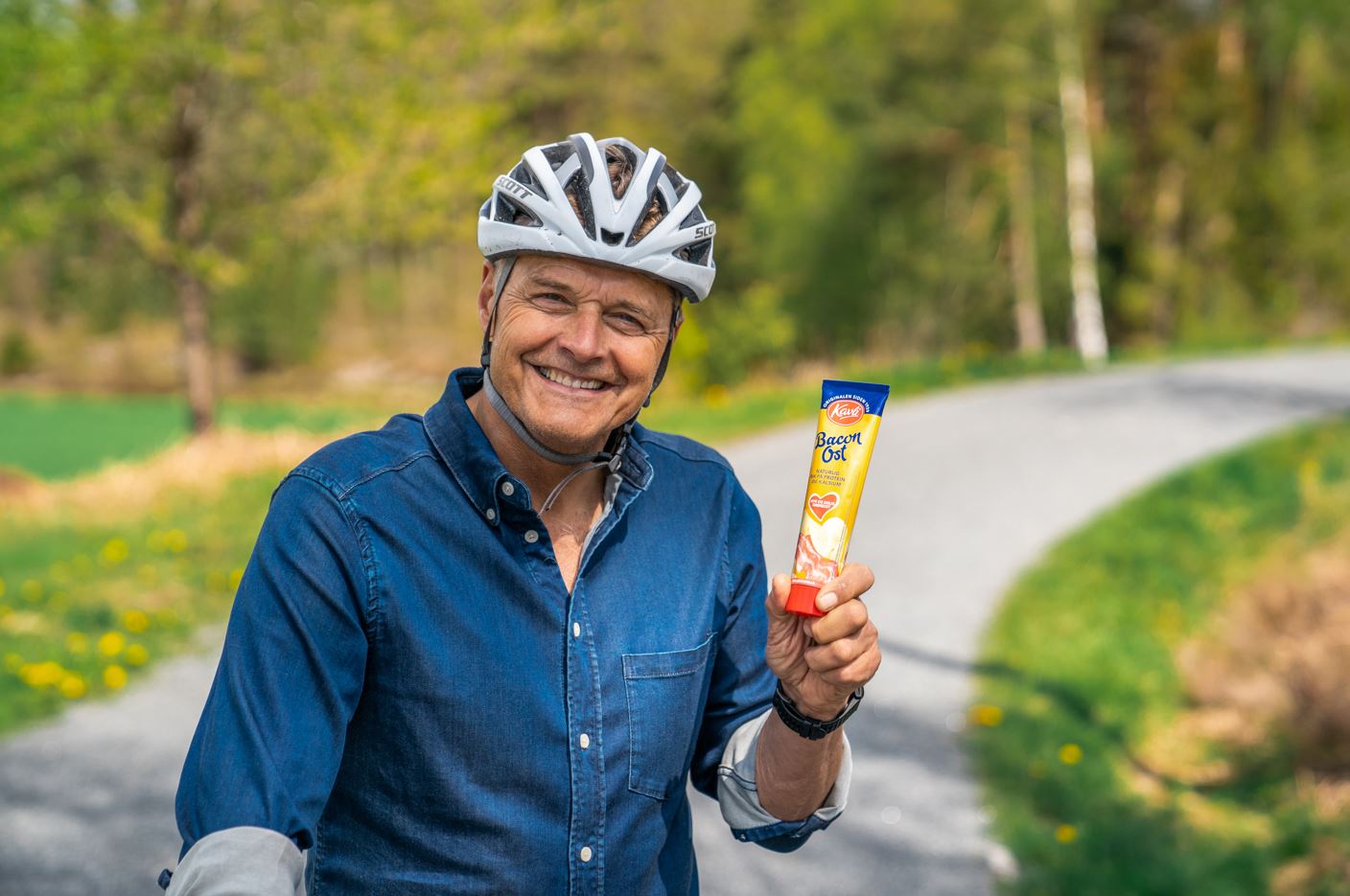 a man holding a popsicle