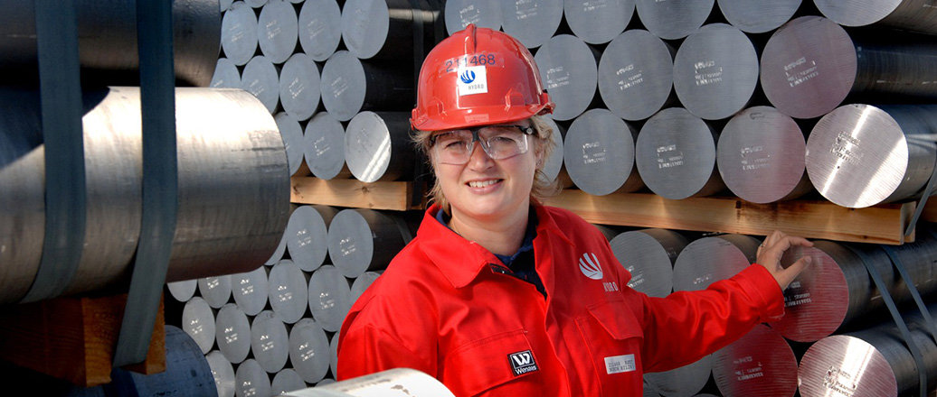 Female worker with aluminium rods