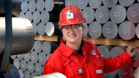 Female worker with aluminium rods