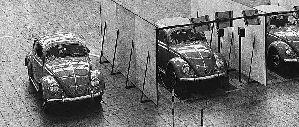 Three VW Beetles in an exhibition