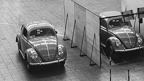 Three VW Beetles in an exhibition