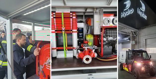 a man standing next to a red and yellow car in a garage