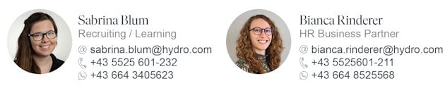 a woman with long curly hair wearing glasses