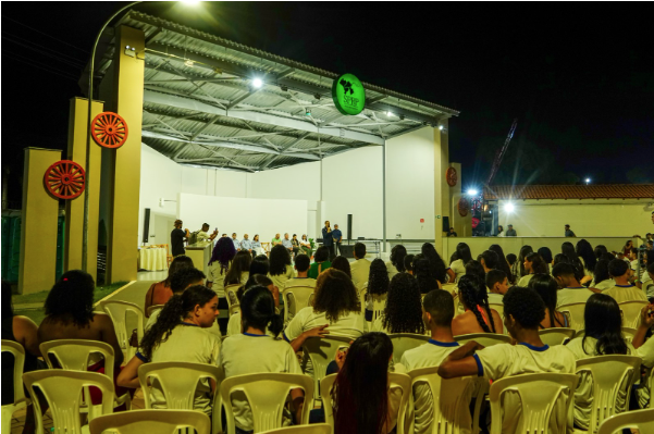 a group of people sitting in chairs