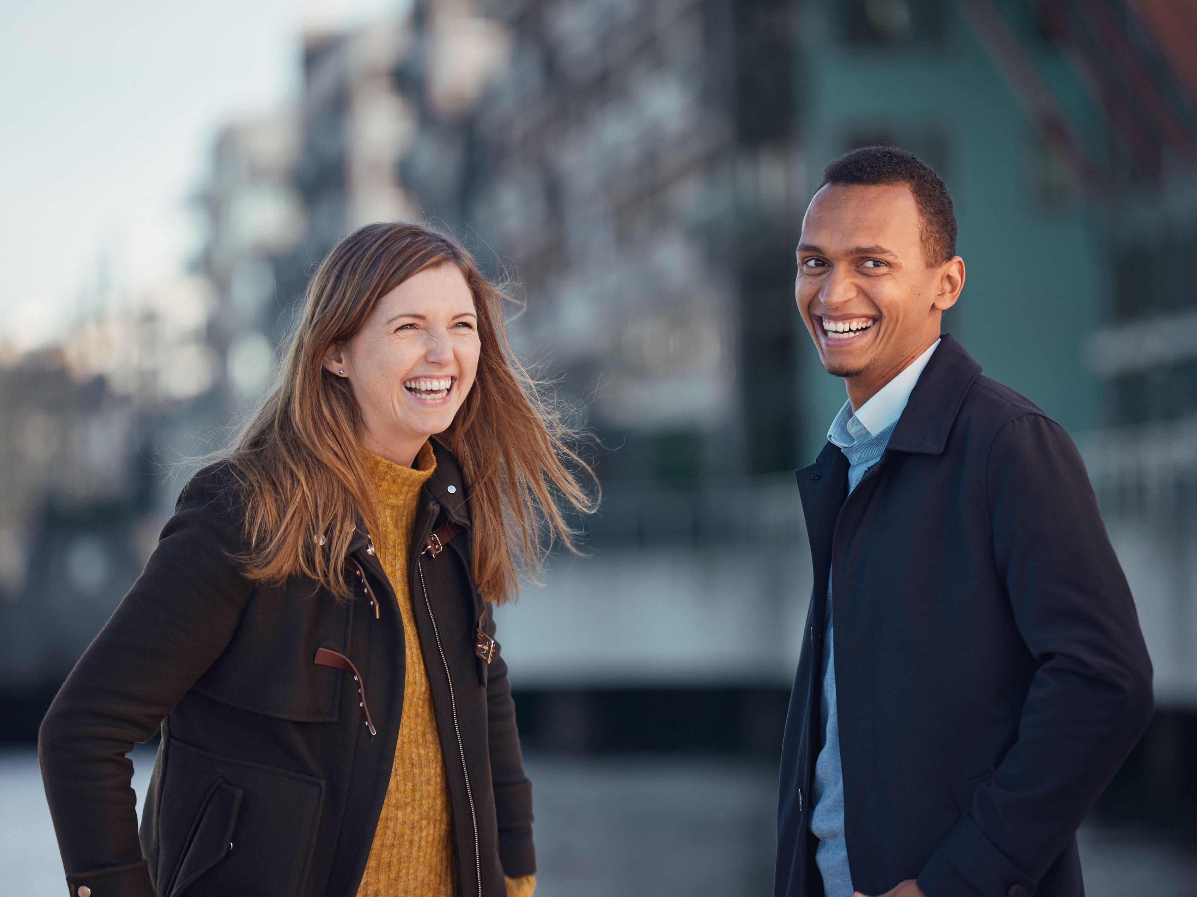 a man and a woman smiling