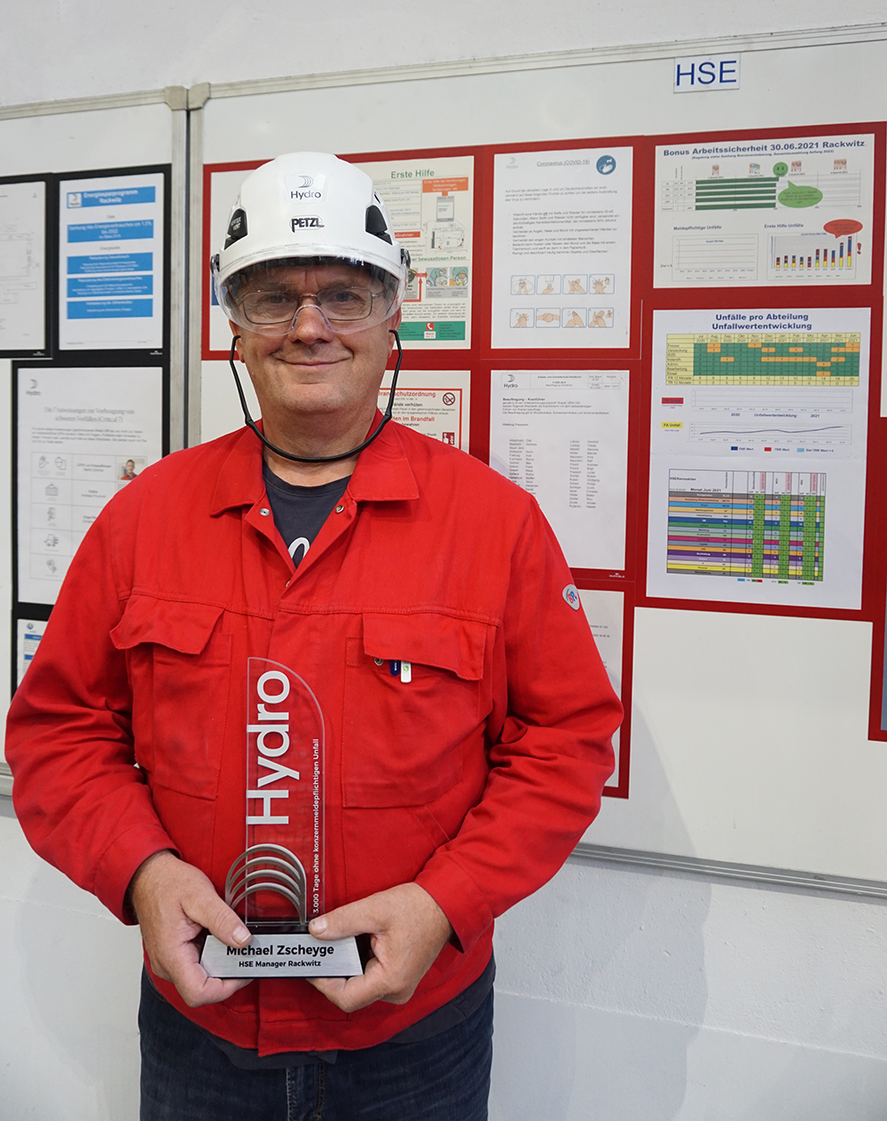 a man holding a trophy