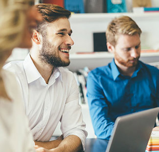 Two persons with laptop