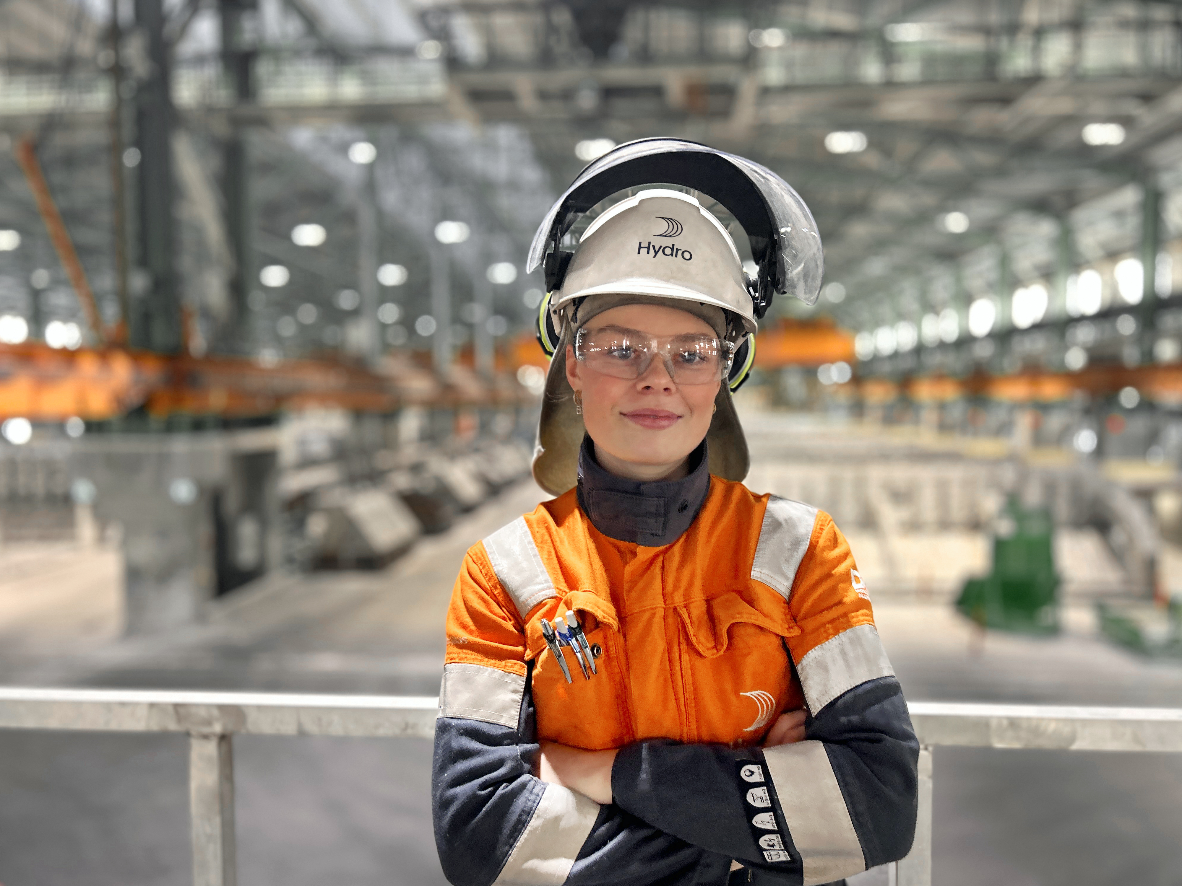 a woman wearing a helmet and hard hat