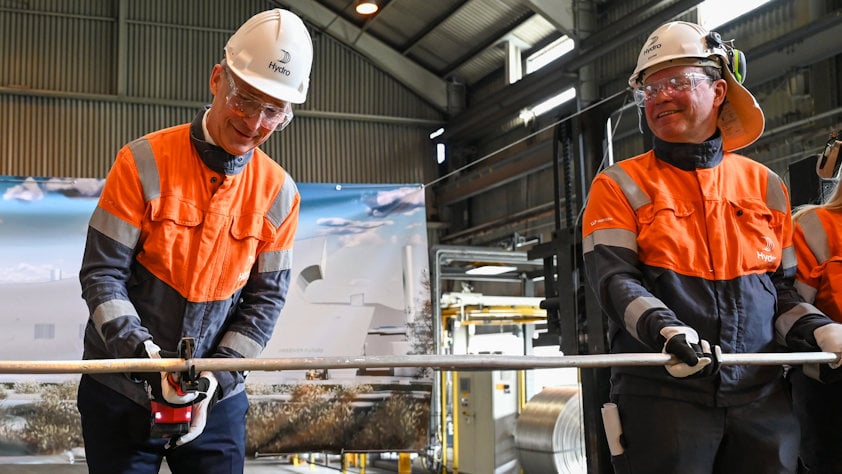 a group of men wearing hardhats and reflectors