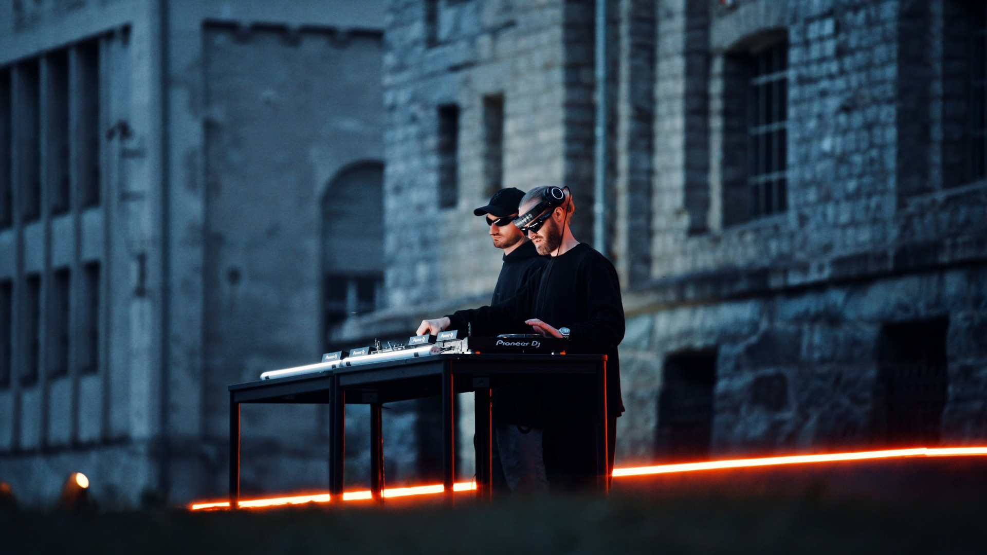 a couple of men playing piano