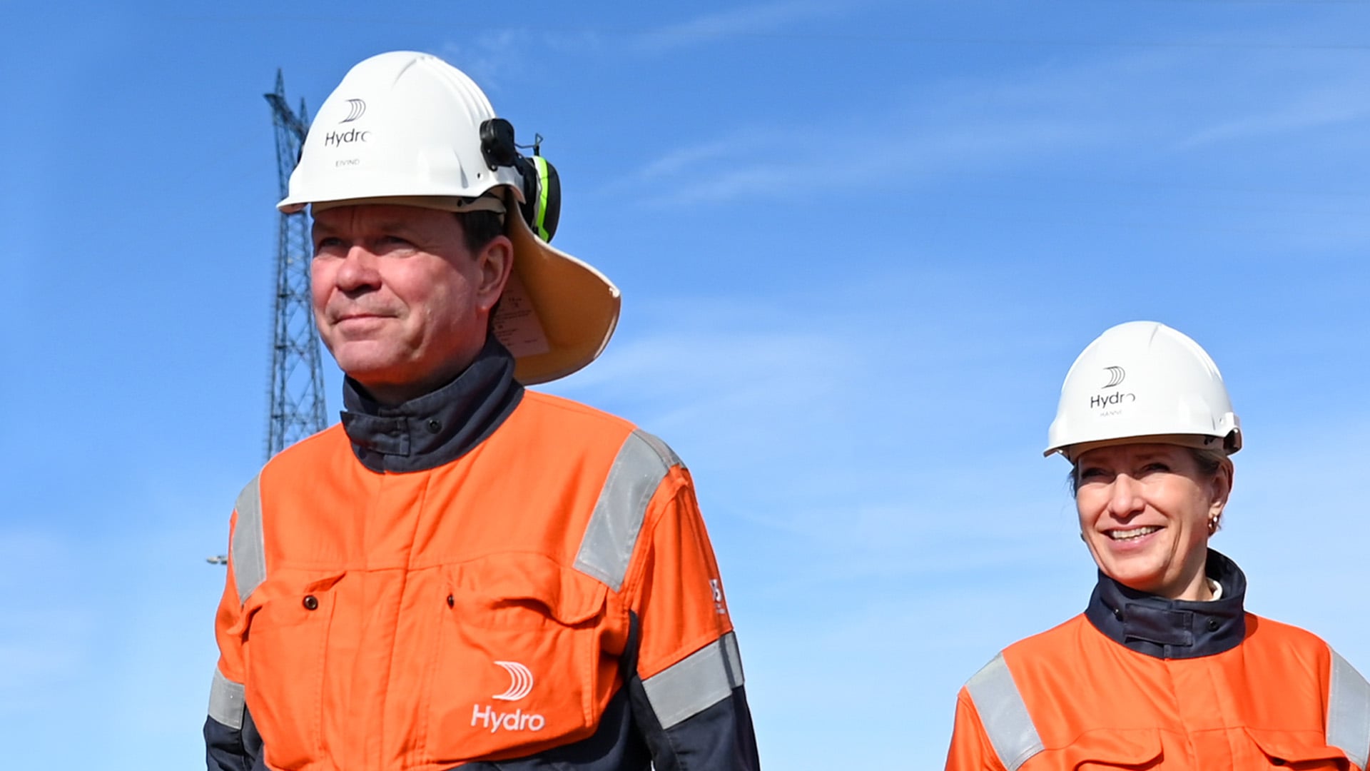 a man wearing a helmet and orange jumpsuit