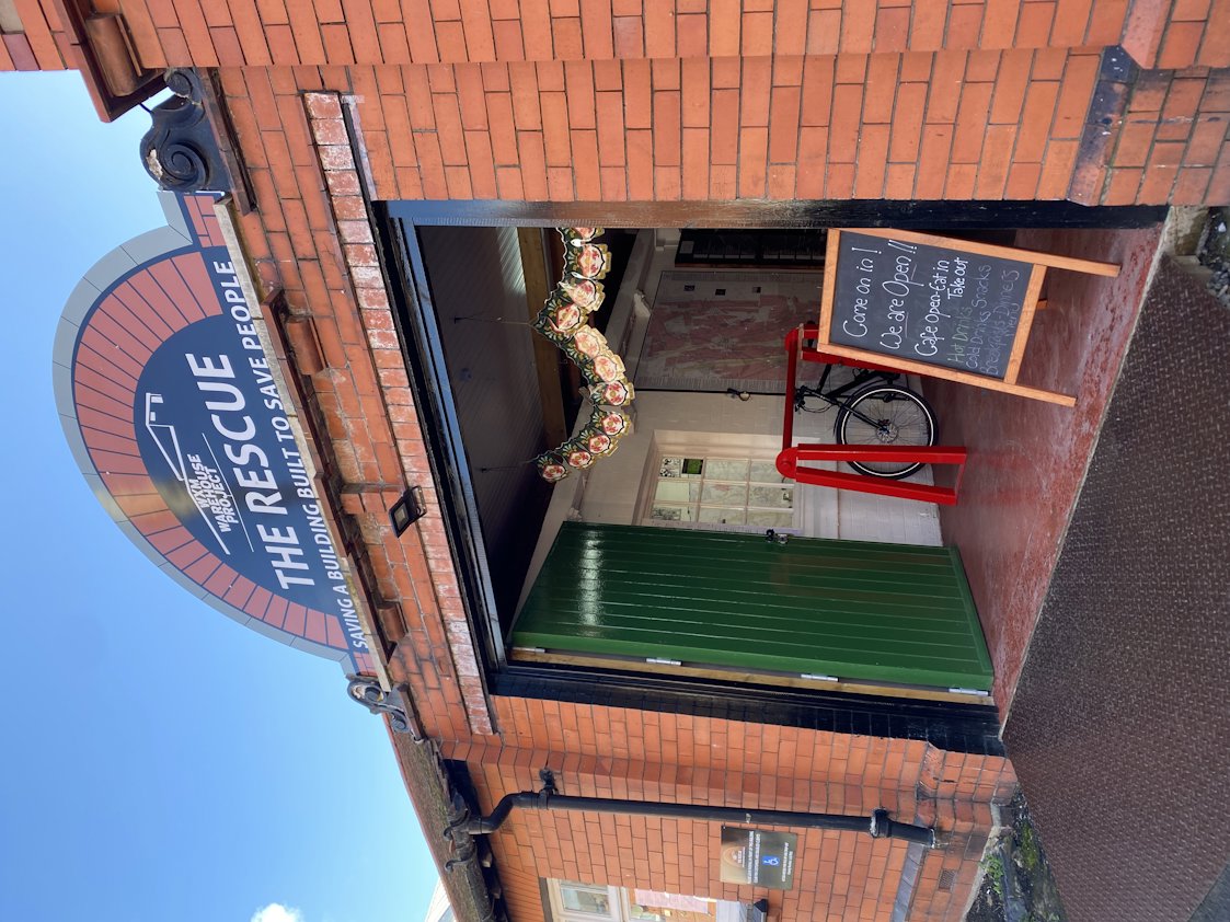 a brick building with a sign on the front