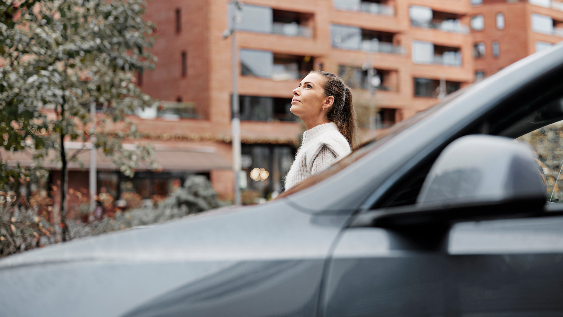 a woman looking out of a car window