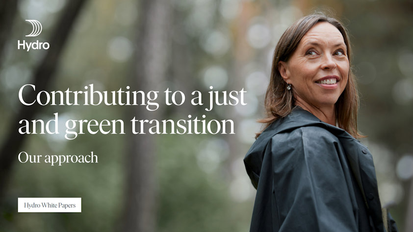 a woman in a black raincoat