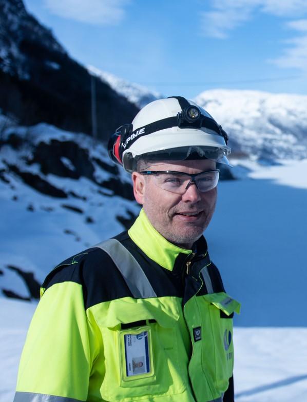 a man wearing a helmet and goggles in the snow