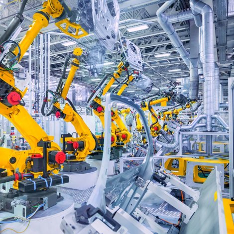 Factory floor with many robot arms