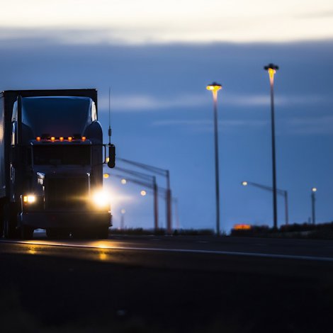Large truck driving at night