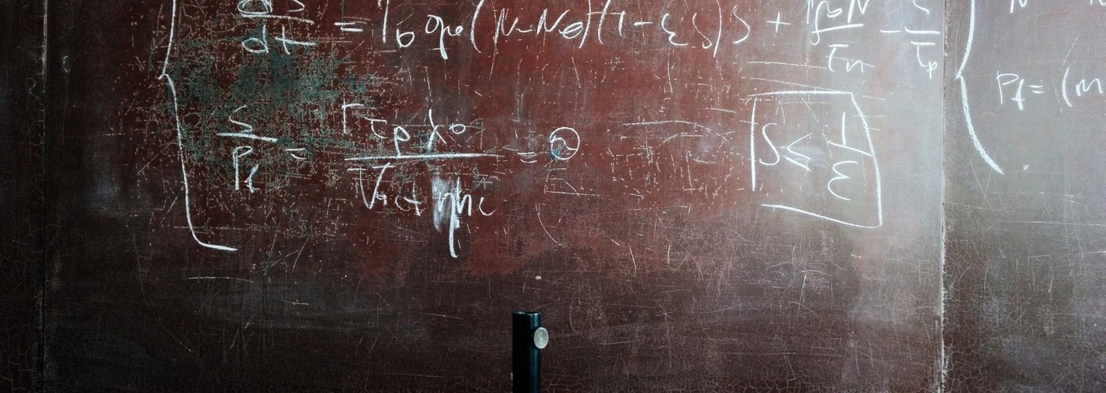 a worn blackboard with science  equations