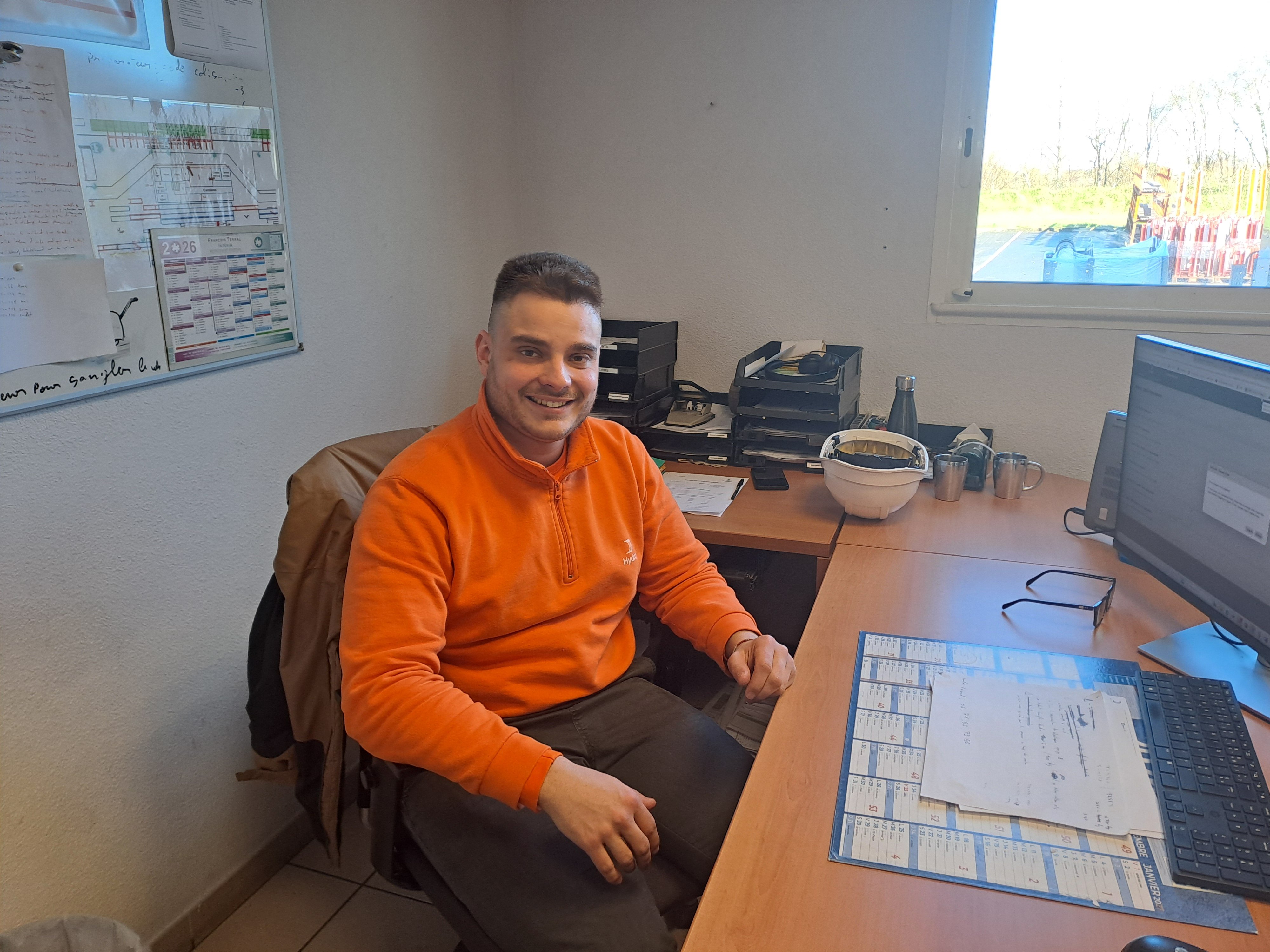 a man sitting at a desk