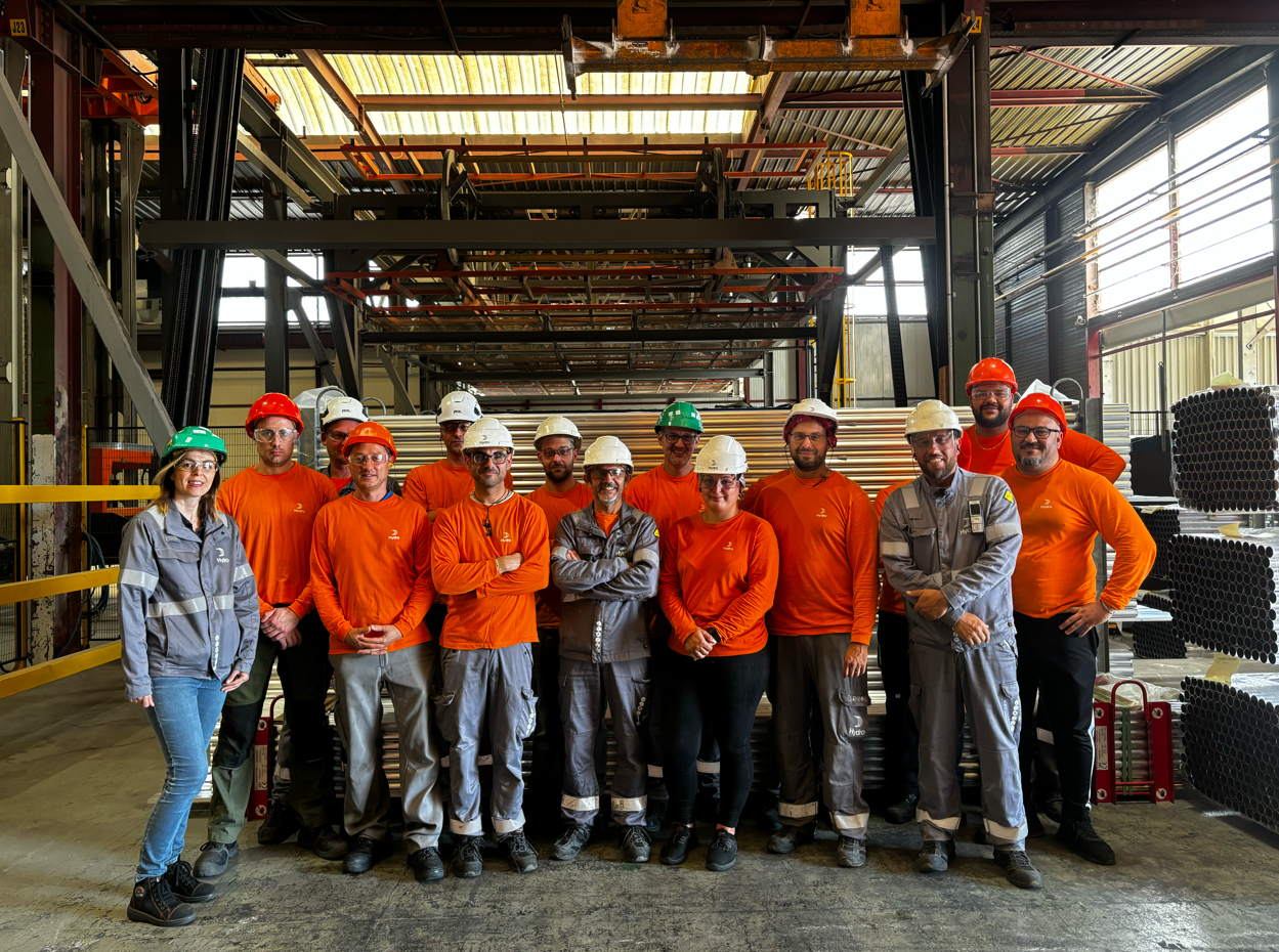 a group of people wearing orange shirts