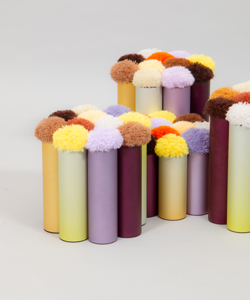 a group of colored pencils