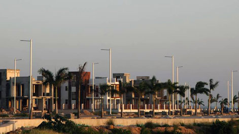 residential buildings, light poles and palms