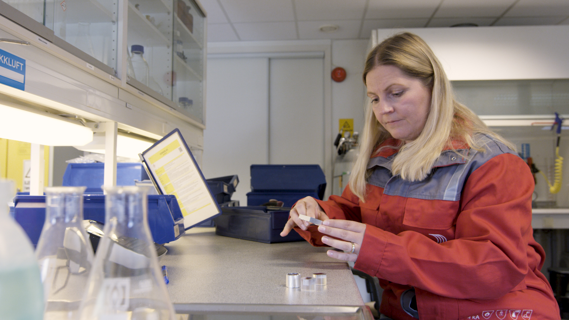 a woman in a red jacket