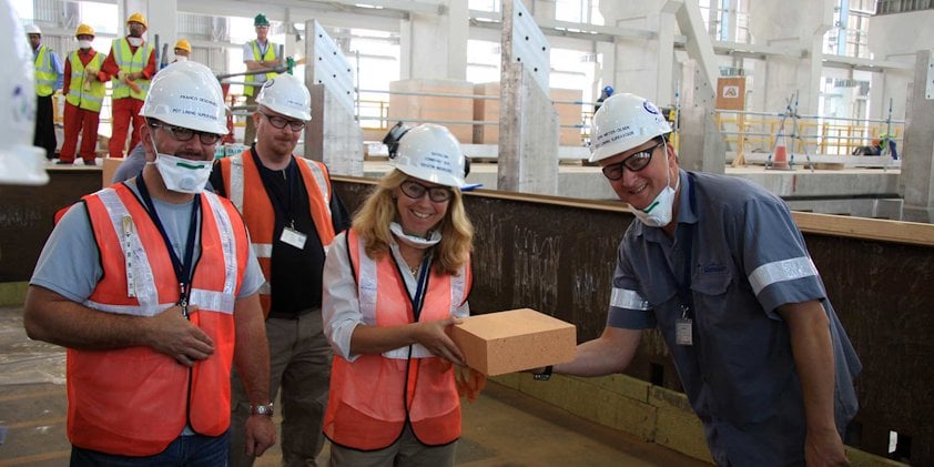 a group of people wearing safety vests and reflectors