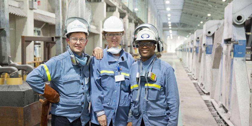 a group of men wearing hard hats